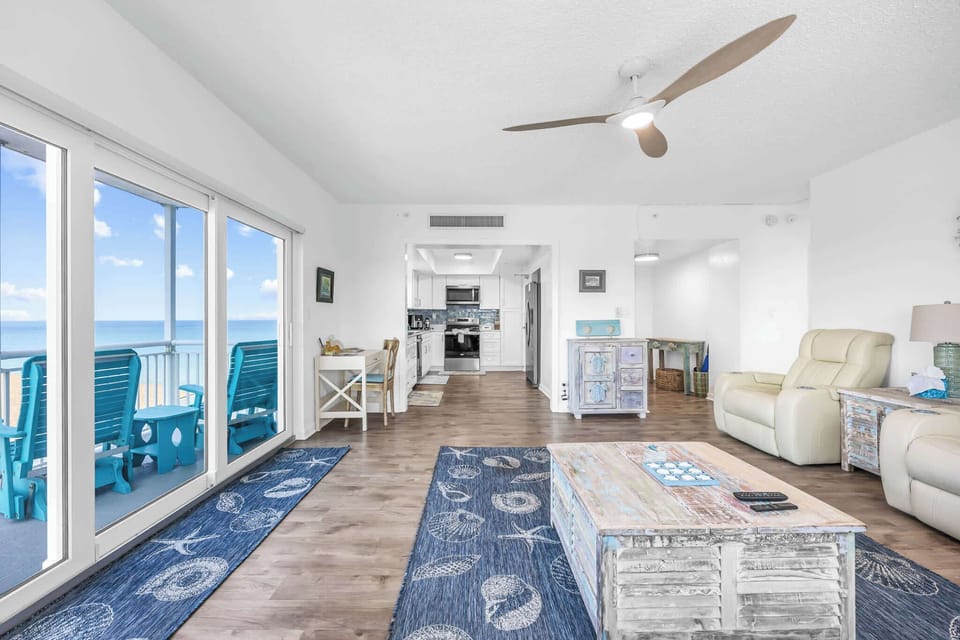 Bright living area with ocean views and coastal decor