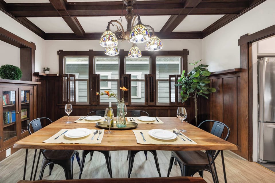 Here is our dining area.Stylish wooden dining area + dreamy chandelier = unforgettable dinners.