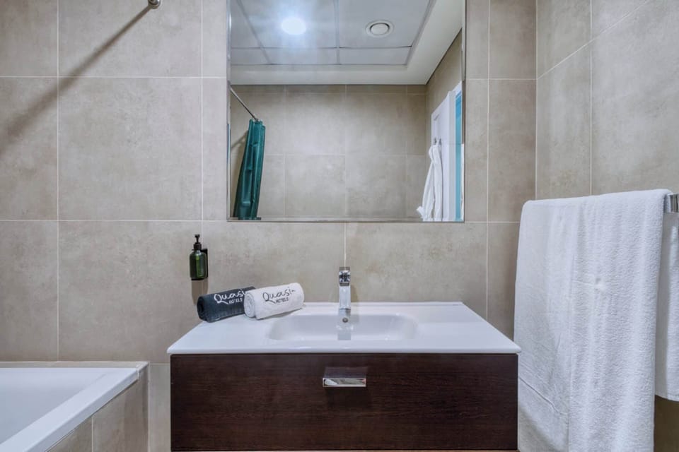 Clean and modern bathroom with sleek vanity, soft lighting, and thoughtful touches. A refreshing space designed for comfort and everyday ease.