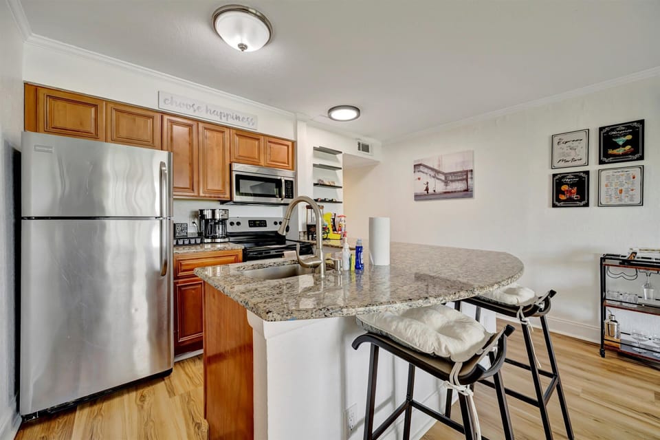 Whip up some culinary magic or just enjoy your morning coffee at this stylish kitchen island! Your perfect foodie getaway starts here