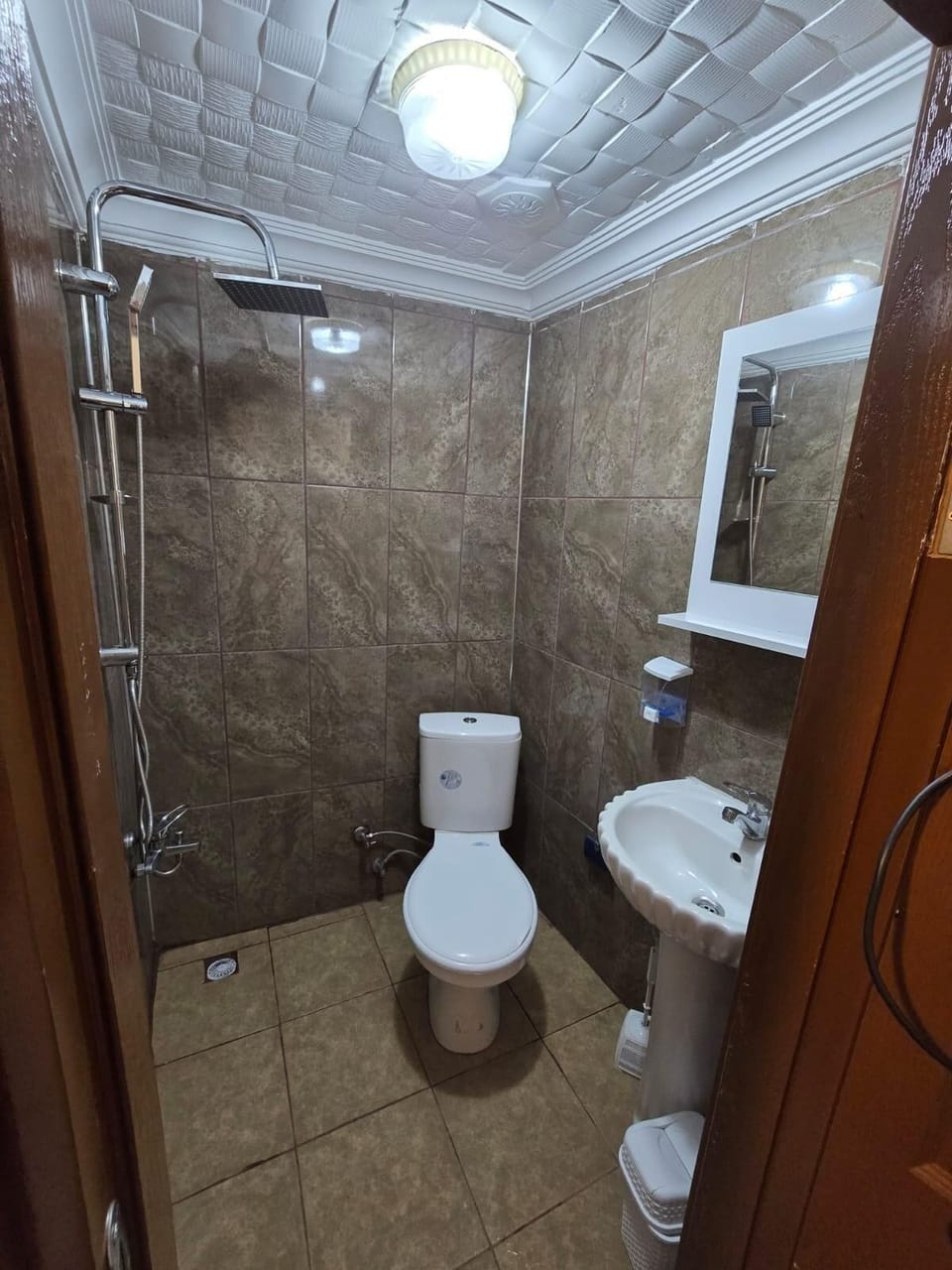 Shower, hair dryer, slippers, towels