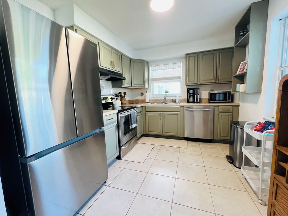 Kitchen with Stainless Steel Appliances. Basic Cooking Essentials Provided. 