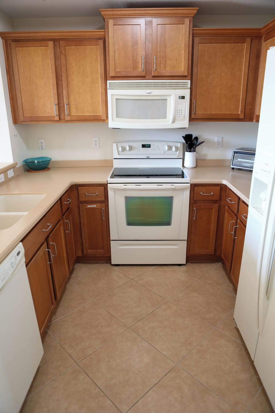 Cozy kitchen with all the essentials, perfect for preparing home-cooked meals.