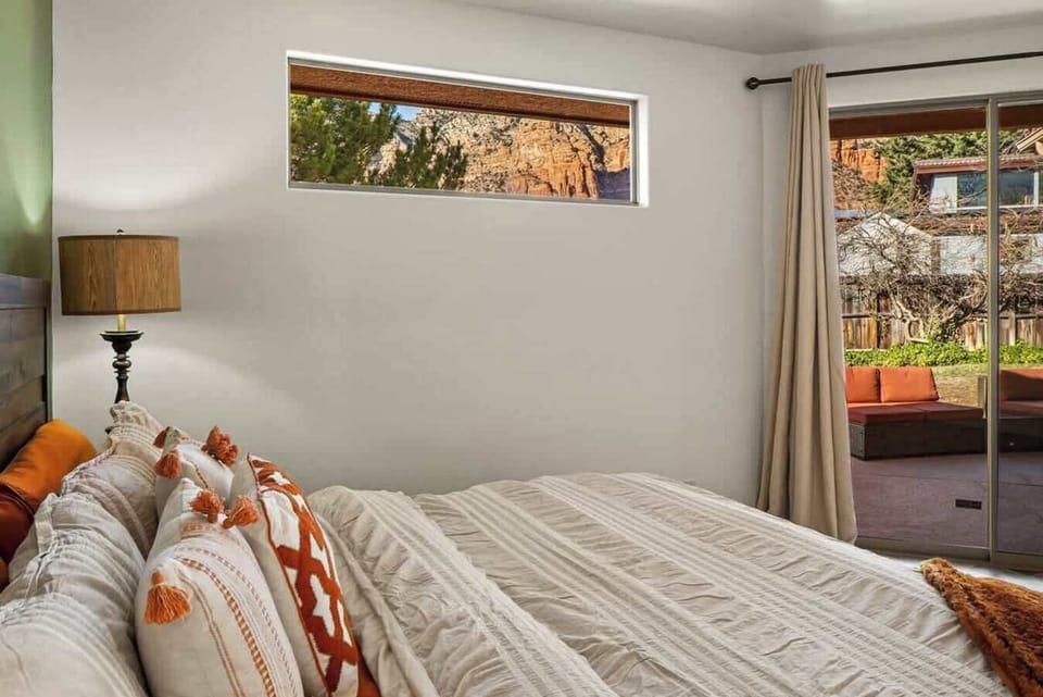 Relax in bed with a view connecting to the outdoor patio.