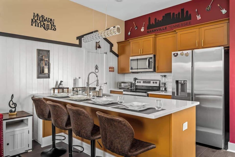 Cook in style in this vibrant, music-inspired Nashville kitchen! With modern appliances, a bold color scheme, and fun décor, it’s perfect for gathering, dining, and enjoying your stay in Music City. Cozy, creative, and full of charm!
