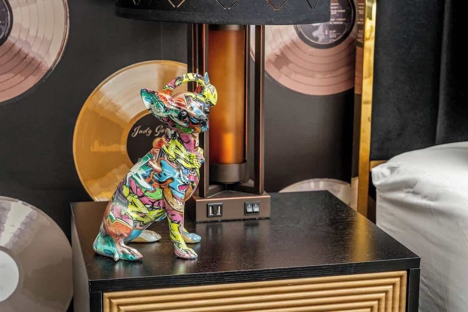 Sleep in style with bold colors, eclectic art, and vintage vinyl charm. This bedroom blends creativity and comfort, perfect for those who love a little funk with their rest.