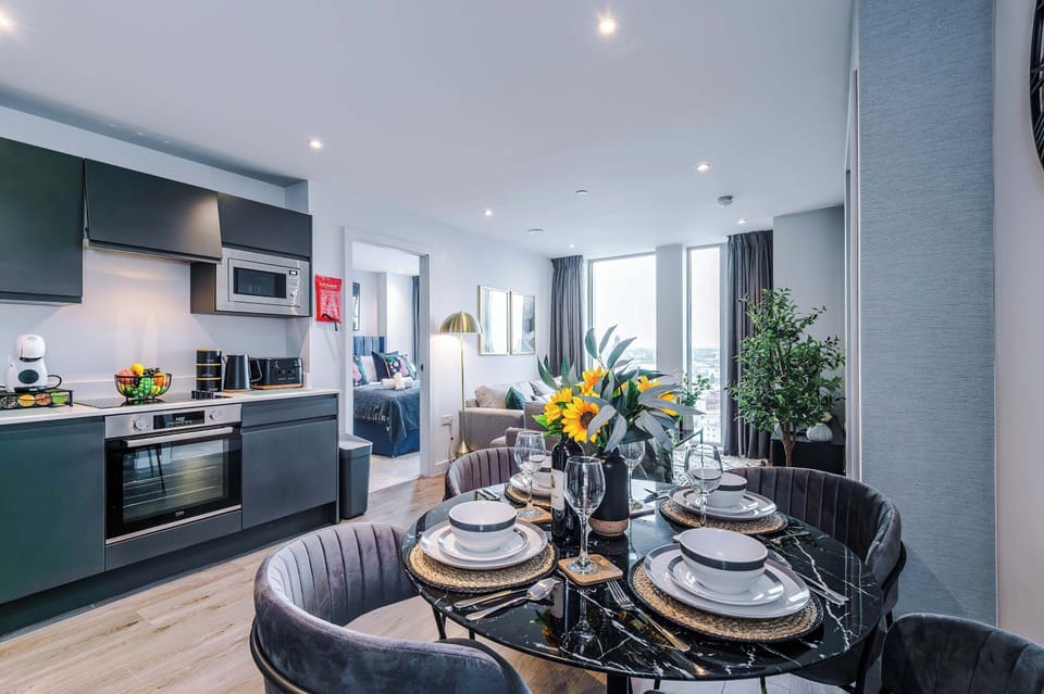 The open-plan living room, dining area and kitchen benefit from a comfortable sofa, SMART TV, complimentary coffee pods, and everything you could possibly need to cook a meal away from home.