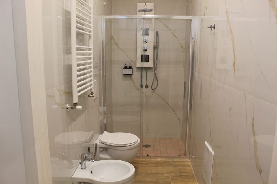 Deluxe Room, Balcony, City View | Bathroom | Shower, hair dryer, bathrobes, slippers