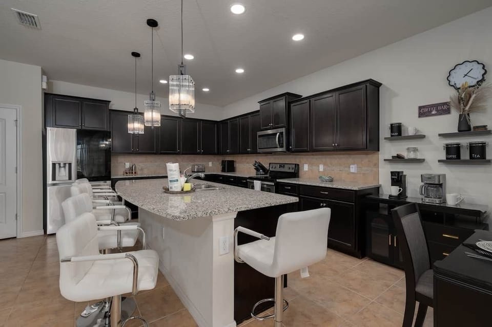 Modern gourmet kitchen with large island and seating for everyone