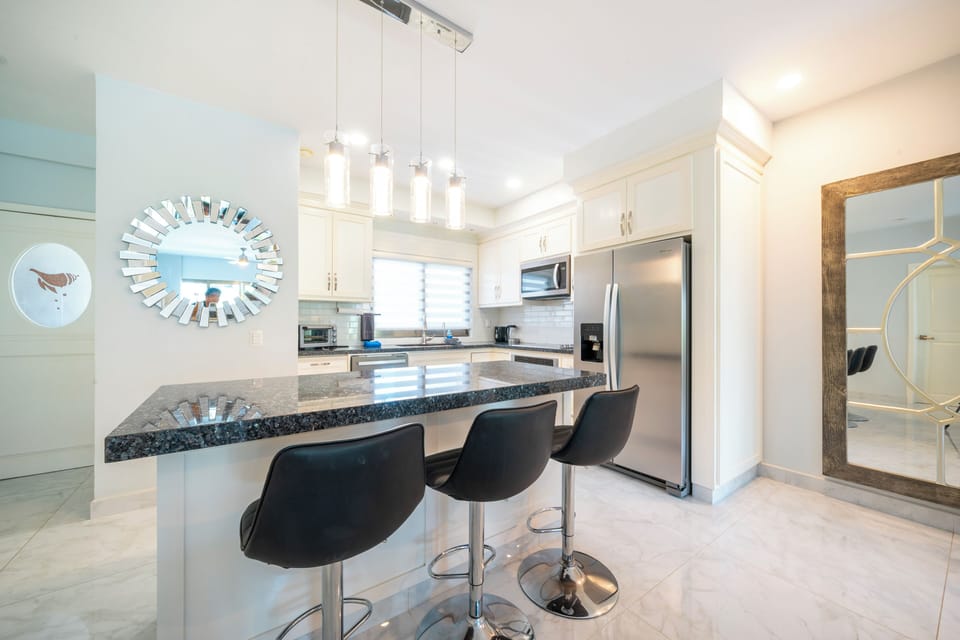 Deluxe Condo, Balcony, Garden View | Private kitchen | Electric kettle