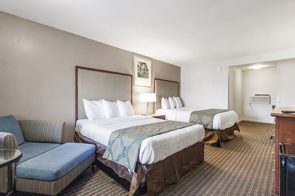 Room, 2 Queen Beds, Non Smoking | Desk, laptop workspace, blackout drapes, iron/ironing board