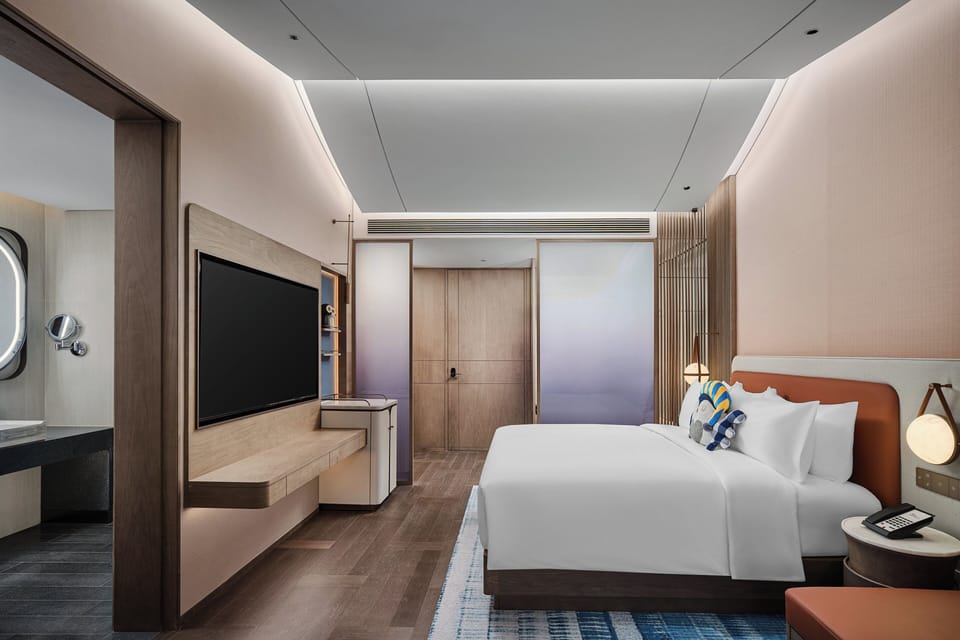 Premium bedding, laptop workspace, blackout drapes, soundproofing
