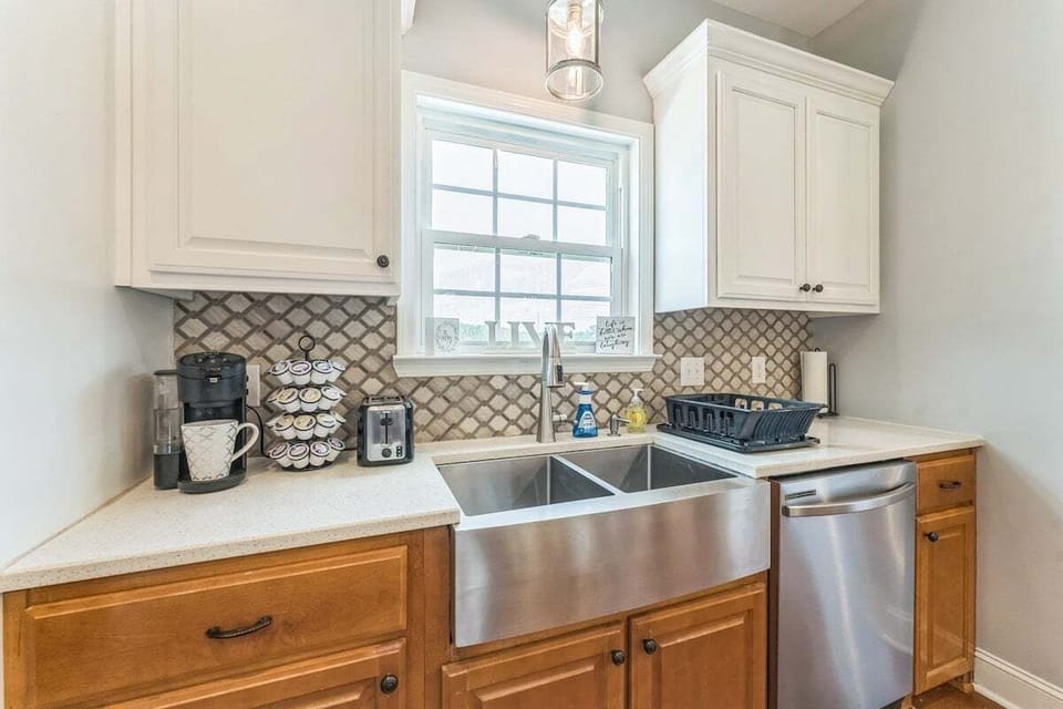 Spacious kitchen with a view—prep meals at the sink while gazing out over the peaceful yard.