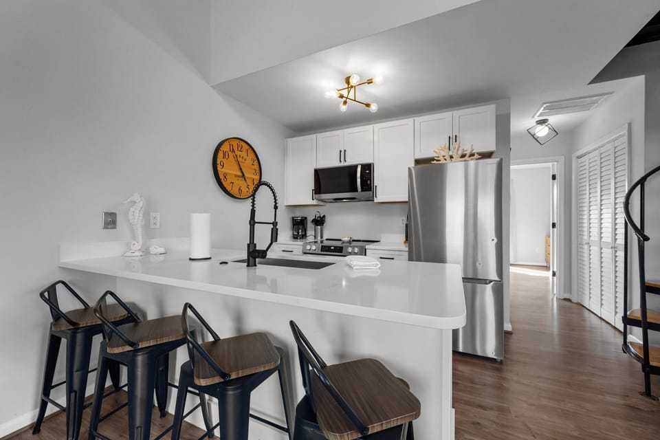 Pull up a stool and chat while dinner cooks in the open kitchen.