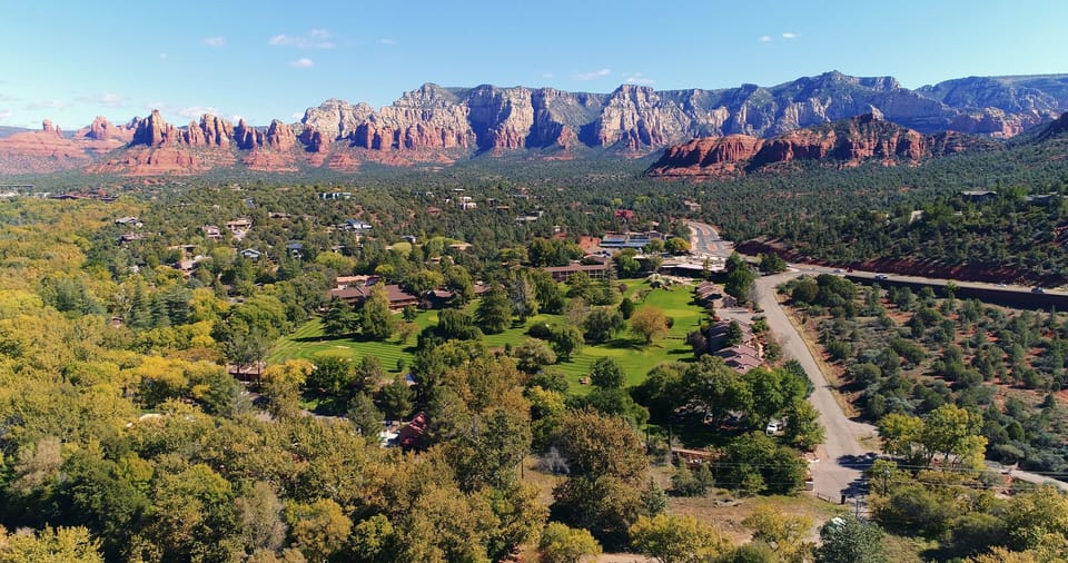 Experience breathtaking red rock views from this peaceful property, nestled among lush greenery and framed by stunning landscapes.