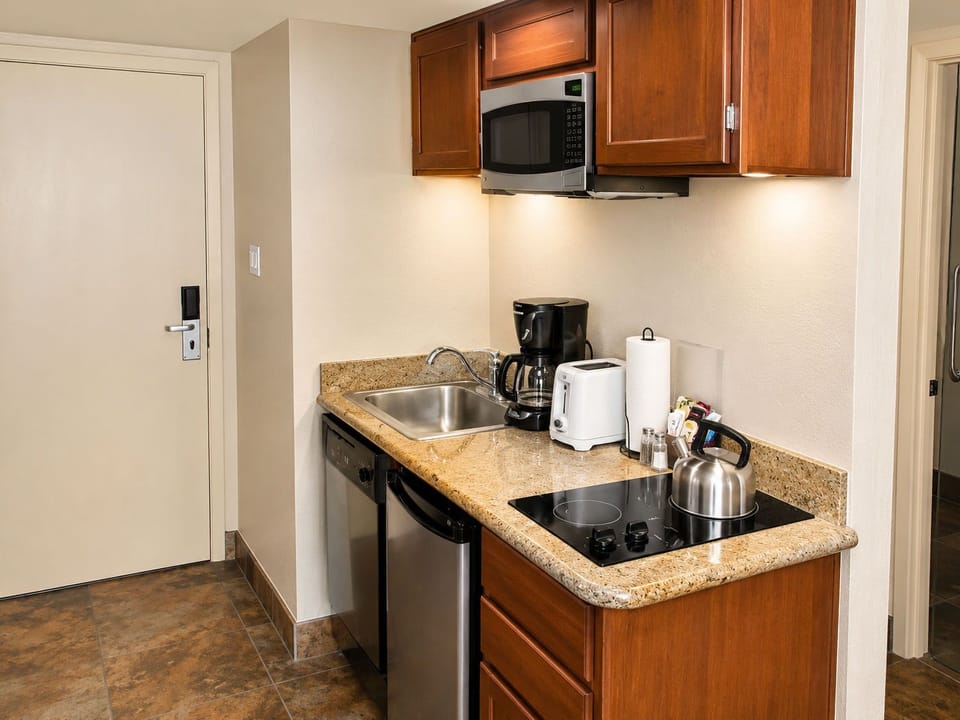 Enjoy the convenience of modern amenities in your cozy kitchen space, complete with everything you need to feel at home while you embark on your desert getaway.