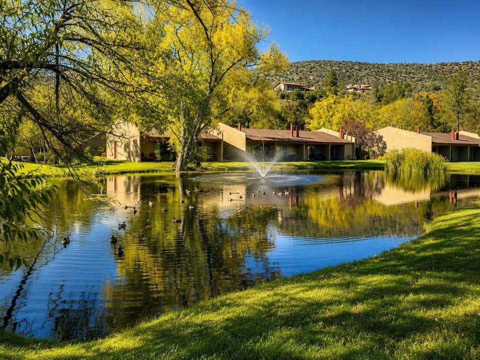 With breathtaking red rock views and lush expansive lawns, this stunning property invites visitors to immerse themselves in the natural beauty of Sedona while relaxing by the tranquil pond.
