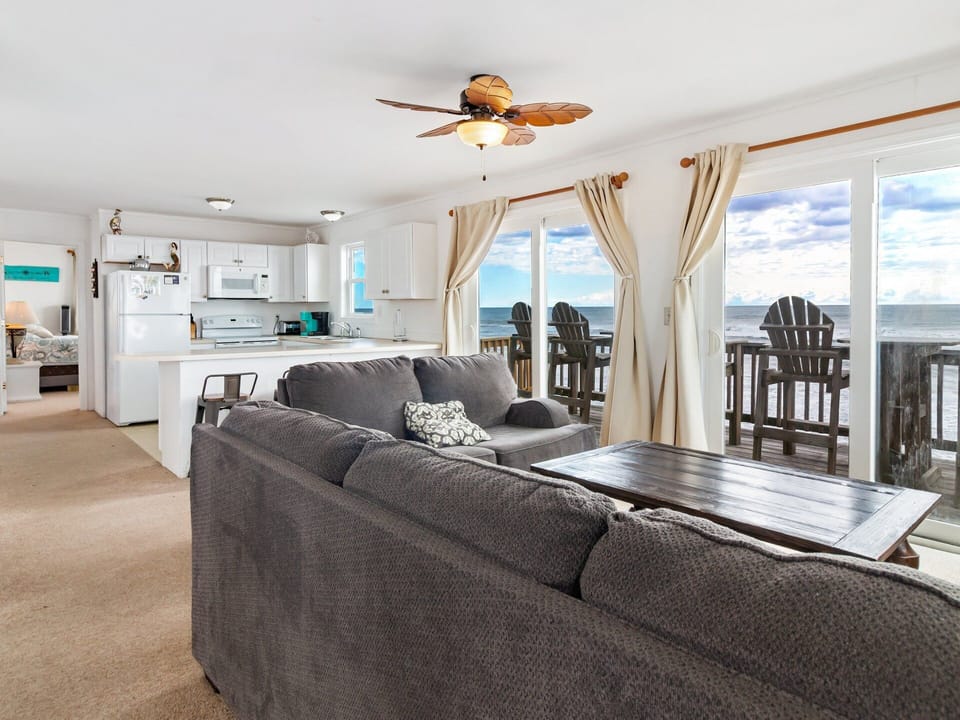 Step inside the Main Level and feel instantly at home in the inviting oceanfront living area, where large windows bring in natural light and sweeping views of the Atlantic.