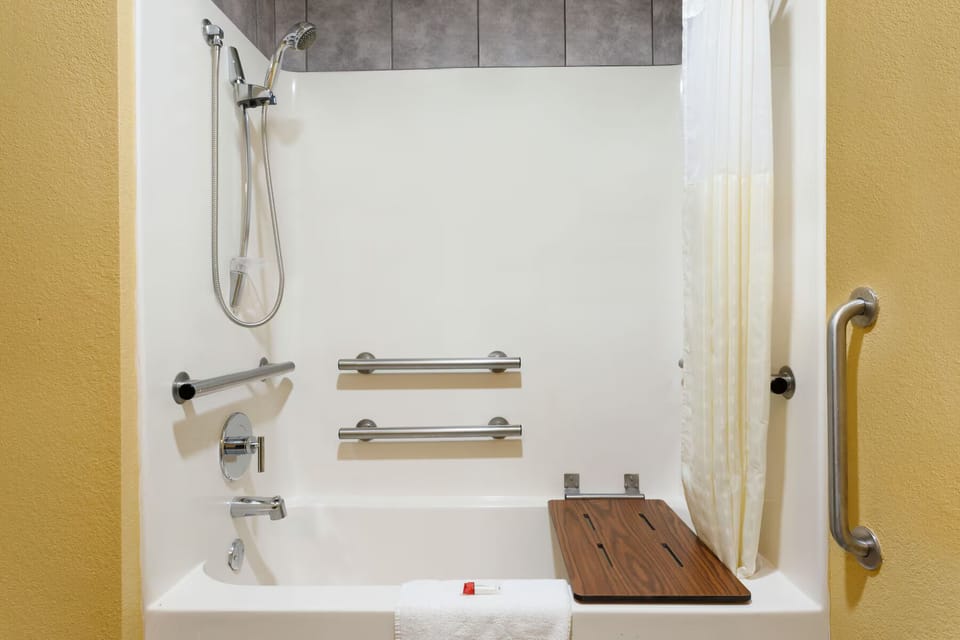 Bathtub, hair dryer, towels, soap