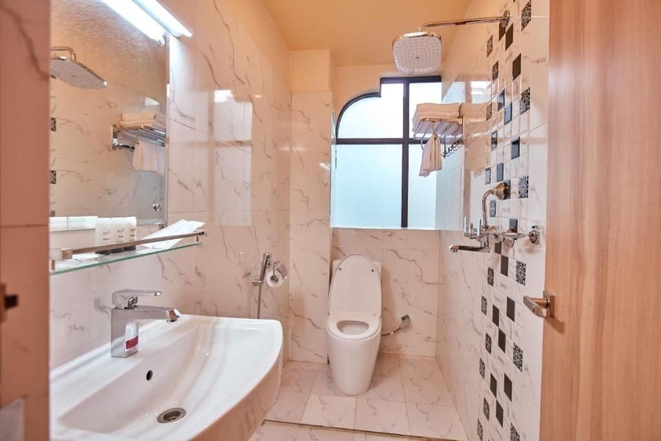 Shower, free toiletries, hair dryer, slippers