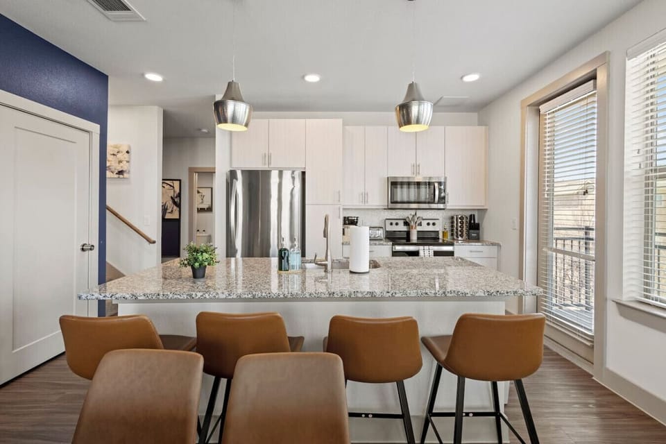 The spacious dining room invites you to savor every moment, whether enjoying a quiet meal or hosting a festive gathering.