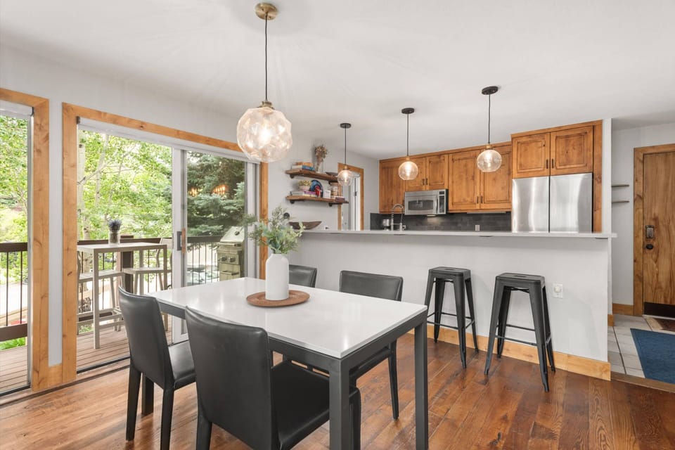 The open and bright kitchen is a perfect place to gather for meals or morning coffee before hitting the trails