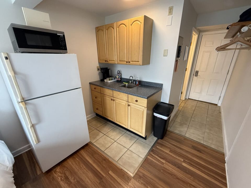 Small space, big convenience! Our modern kitchenette is fully equipped with a microwave, mini-fridge, and all the essential cookware for a quick and easy meal.