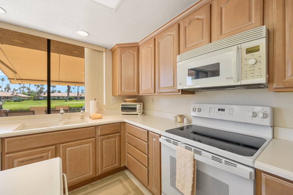 Spacious kitchen counter and fully equipped with modern appliances