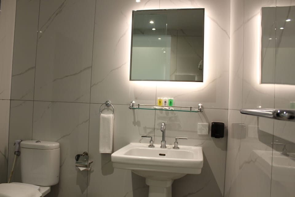 Shower, free toiletries, slippers, soap