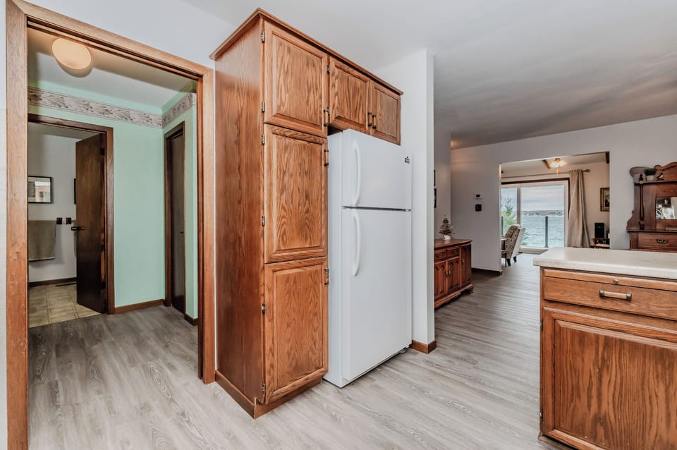 Convenient and functional kitchen space connects easily to living areas, creating a welcoming atmosphere for your cottage retreat.