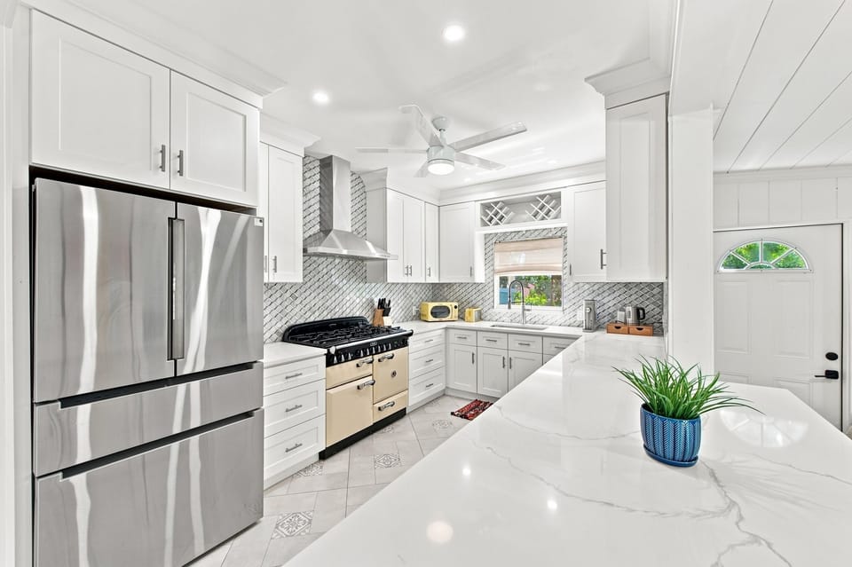 Modern kitchen with stainless steel appliances and subway tile backsplash