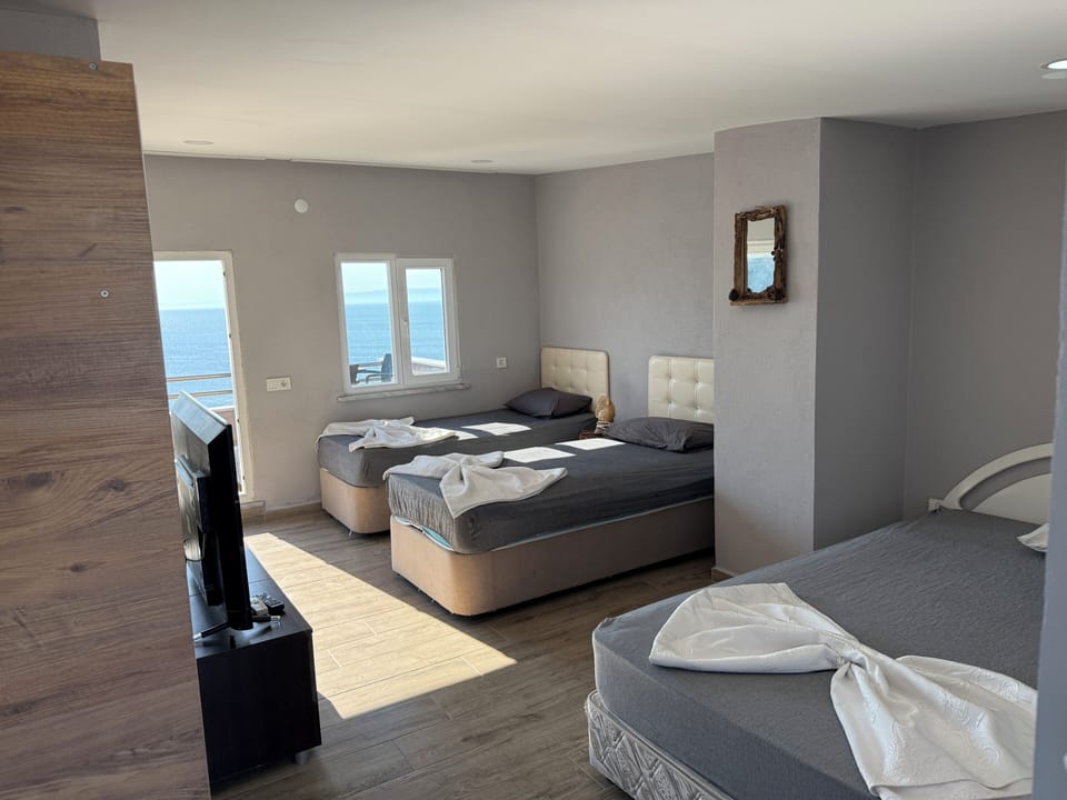 Luxury Quadruple Room, Sea View | WiFi (free), bed sheets