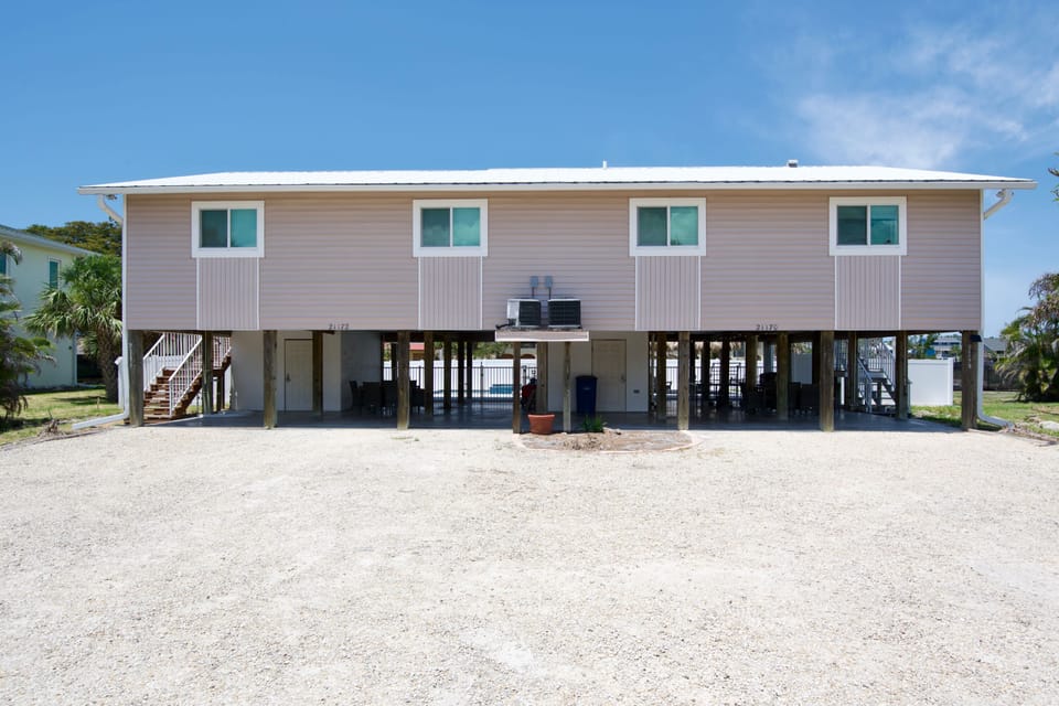 Duplex with divided underneath hangouts.