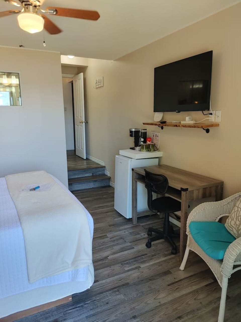 Bedroom, with work station, sitting area and mini fridge with coffee/tea station
