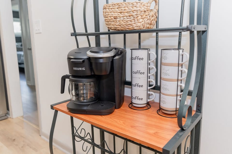 Coffee bar, k-pods, cream and sugar are provided