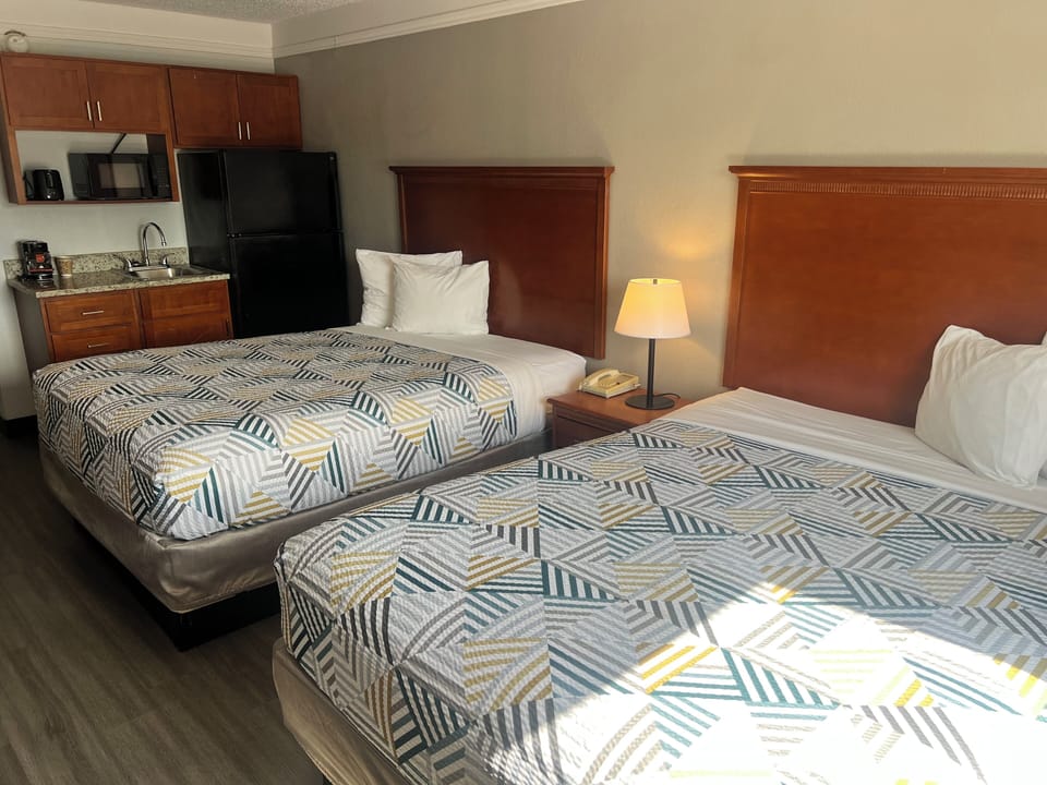 Deluxe Double Room, 2 Queen Beds, Non Smoking, Kitchenette | Desk, laptop workspace, blackout drapes, iron/ironing board