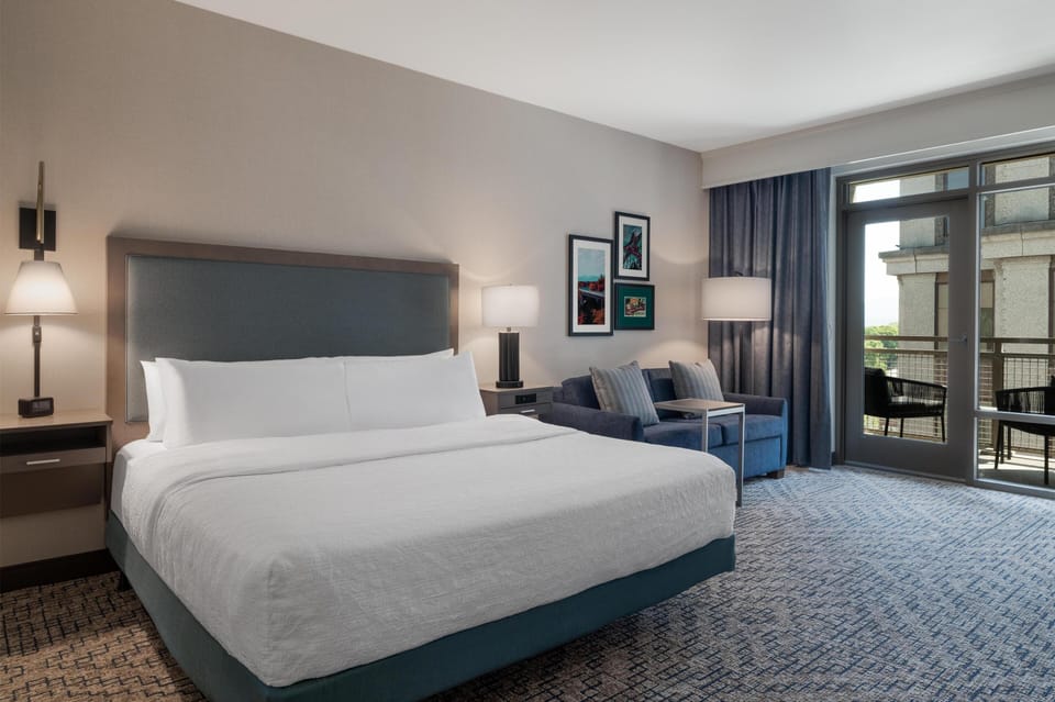Room, 1 King Bed, Accessible (Roll-in Shower) | Living area | 42-inch LCD TV with cable channels, TV, pay movies