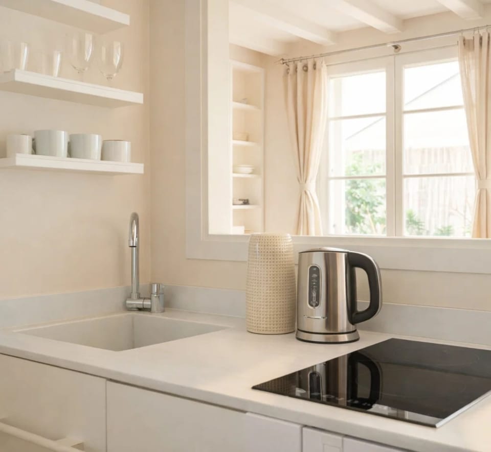 Deluxe Studio, Courtyard View | Private kitchen | Espresso maker, electric kettle, toaster, freezer
