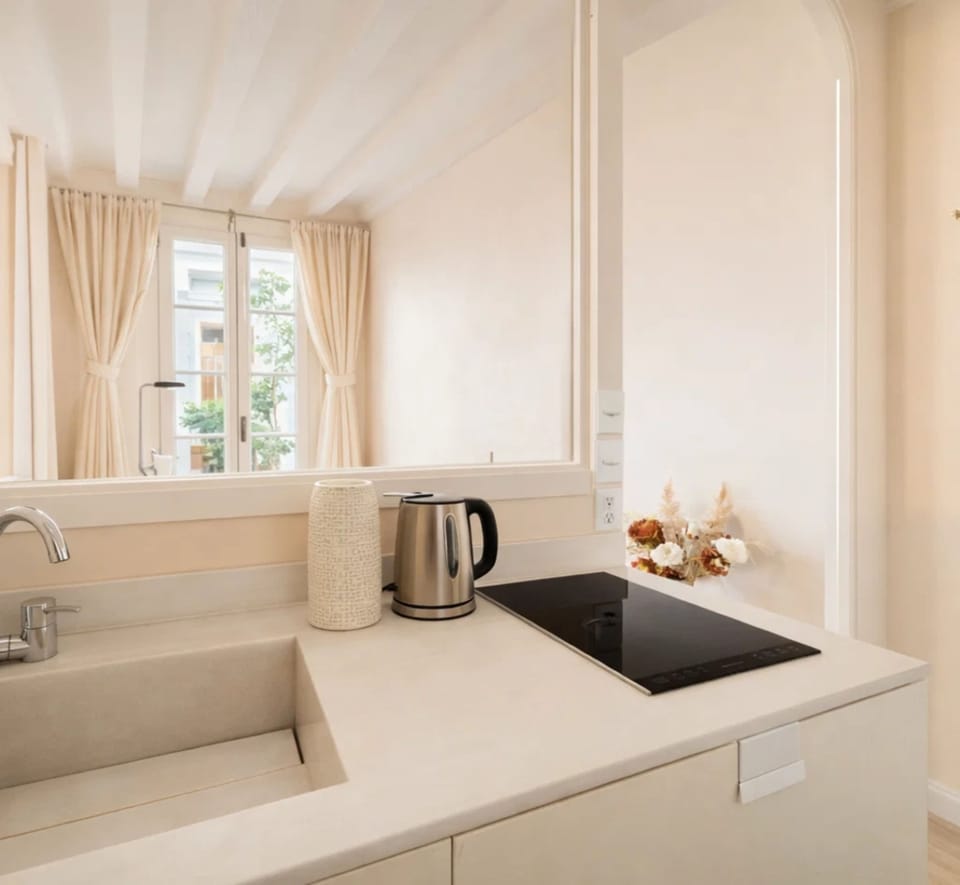 Deluxe Studio, Courtyard View | Private kitchen | Espresso maker, electric kettle, toaster, freezer