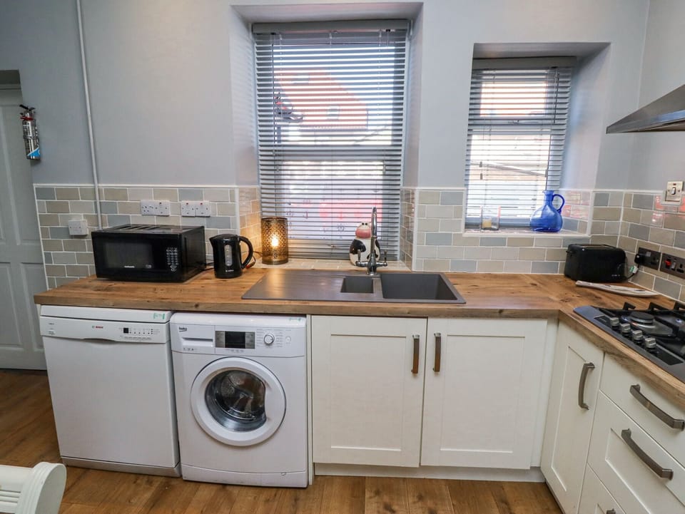 Fridge, microwave, toaster, cookware/dishes/utensils