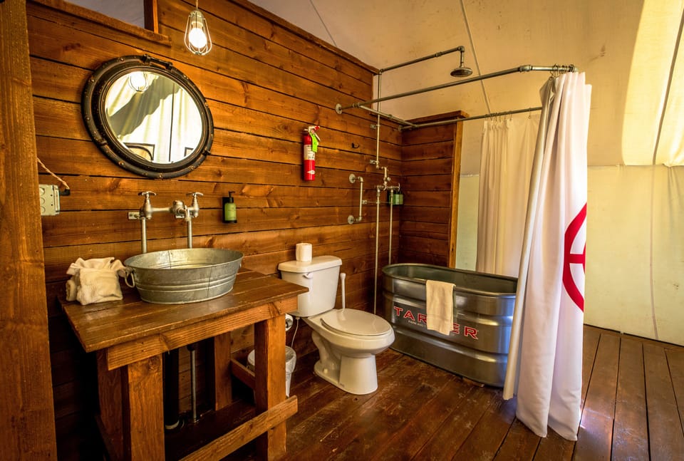 Grand Tent (Couples) | Bathroom | Combined shower/tub, rainfall showerhead, free toiletries, towels