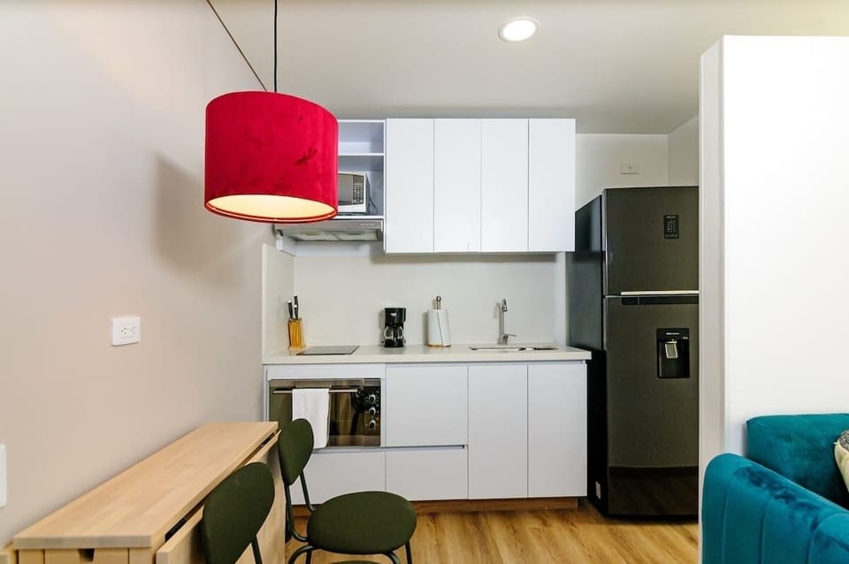 Apartment, 1 Queen Bed, Balcony, City View (GO 1703) | Private kitchen | Coffee/tea maker