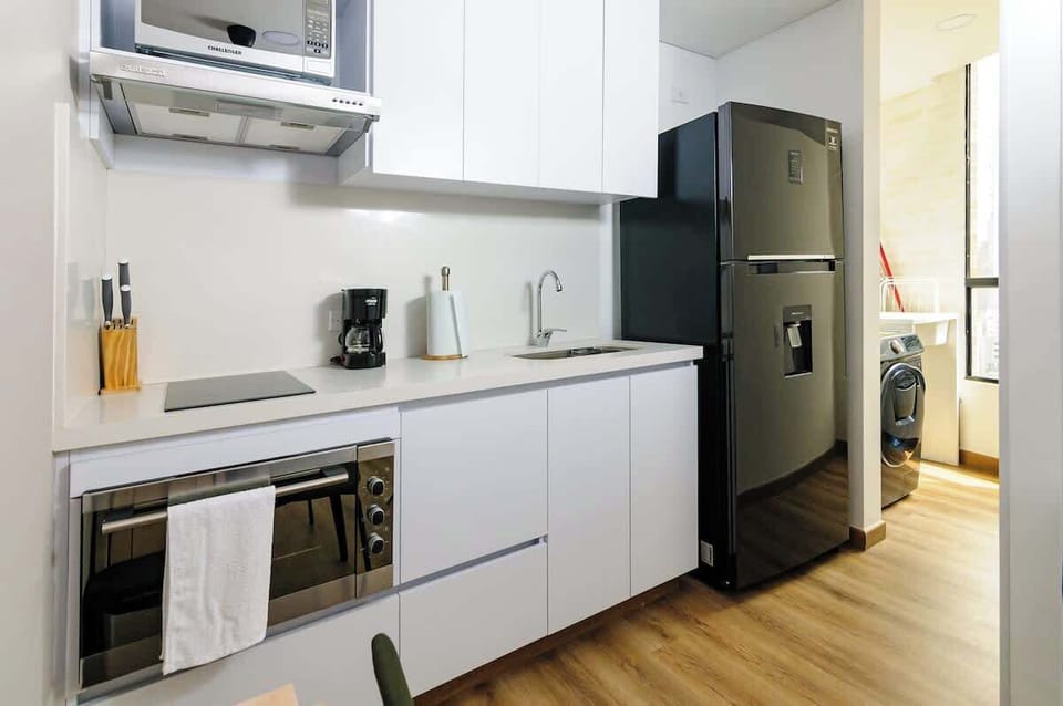Apartment, 1 Queen Bed, Balcony, City View (GO 1703) | Private kitchen | Coffee/tea maker