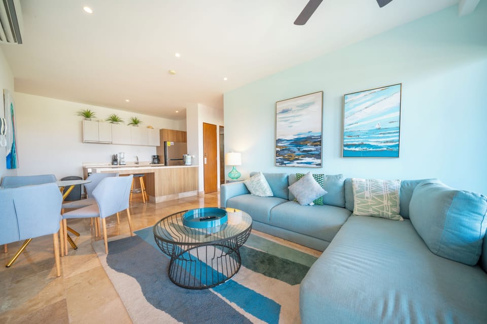 Deluxe Condo, Balcony, City View | Living area | 65-inch Smart TV with digital channels