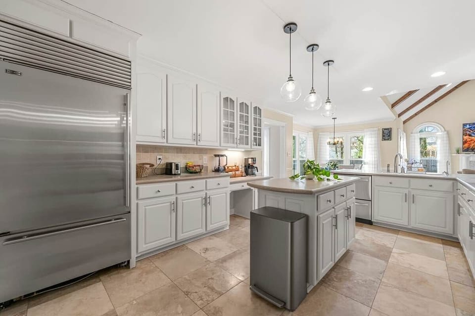 Spacious and bright kitchen with an open floor plan, perfect for cooking and gathering.