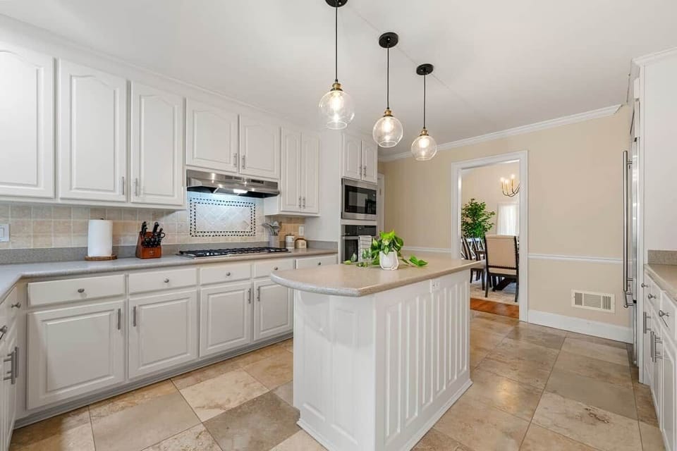Fully equipped kitchen with pots, pans, and everything you need to cook a delicious meal.