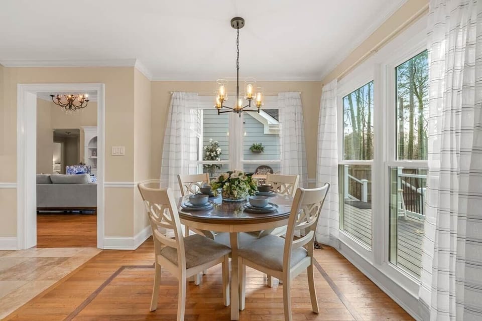 Cozy breakfast nook with large windows—perfect for enjoying sunny mornings or watching the rain with a warm cup of coffee.