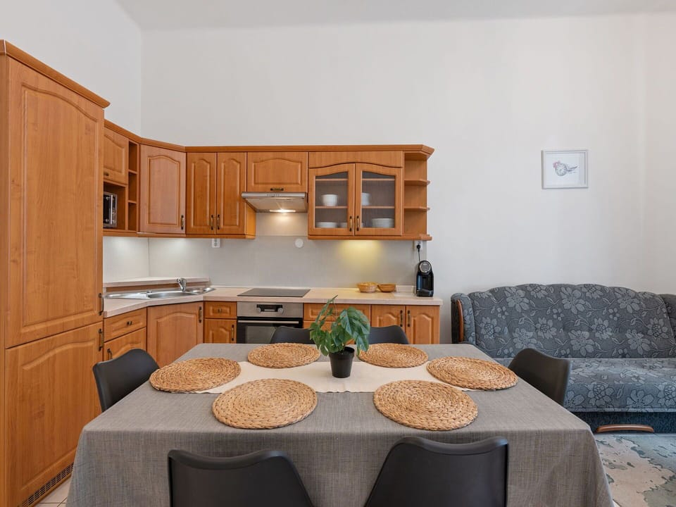 Furniture, Interior Design, Flooring, Wood, Floor, Cabinetry, Room, Table, Kitchen, Apartment
