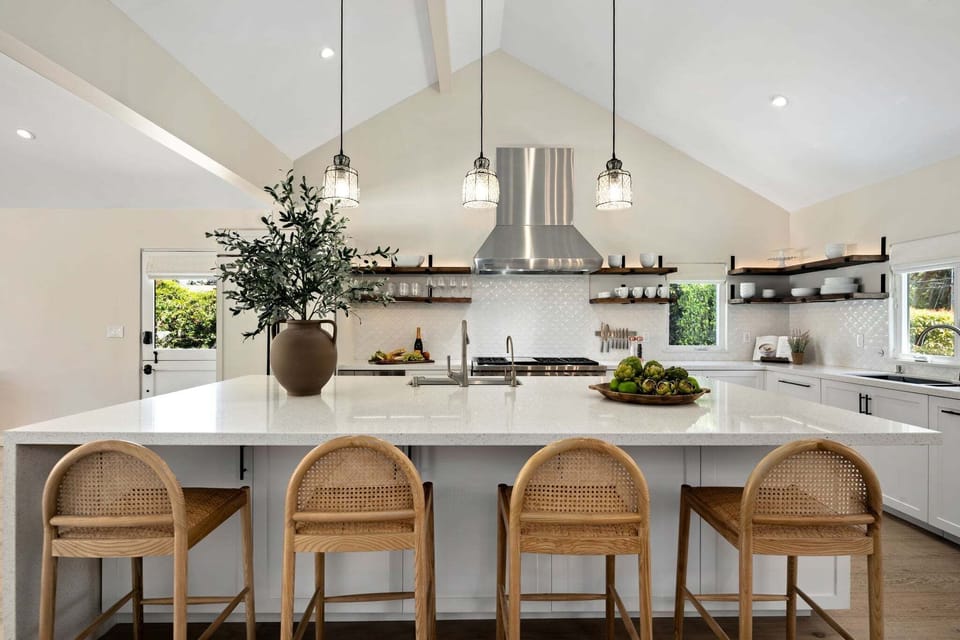Bar stools line the massive kitchen island - the perfect place to gather!