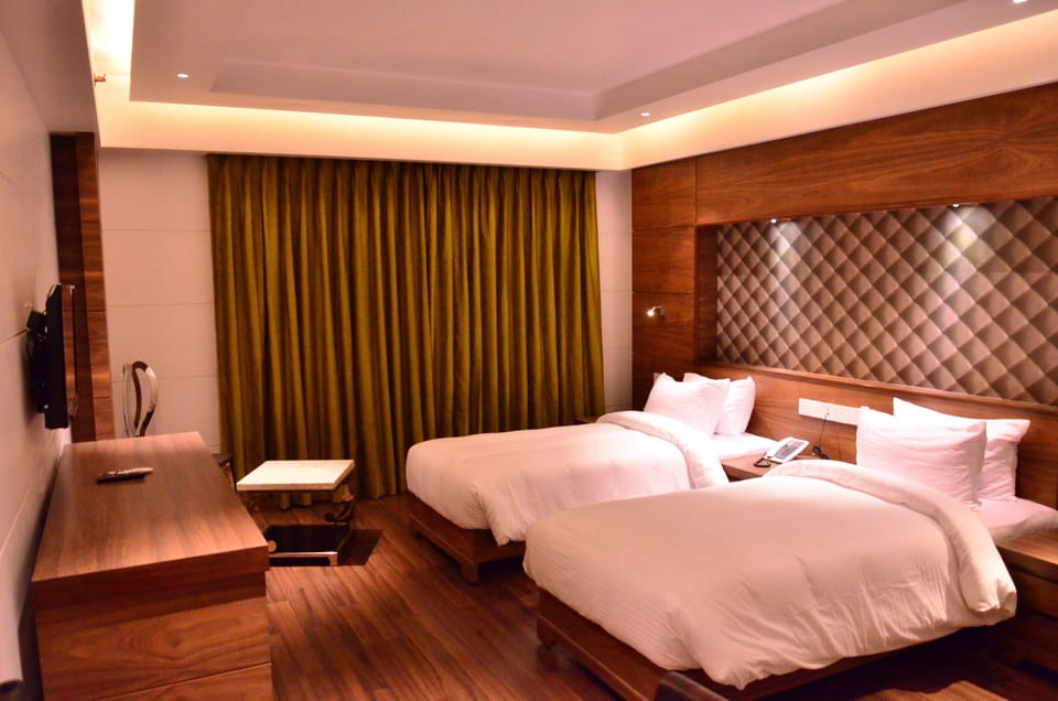 Deluxe Room, City View | In-room safe, desk, laptop workspace, iron/ironing board